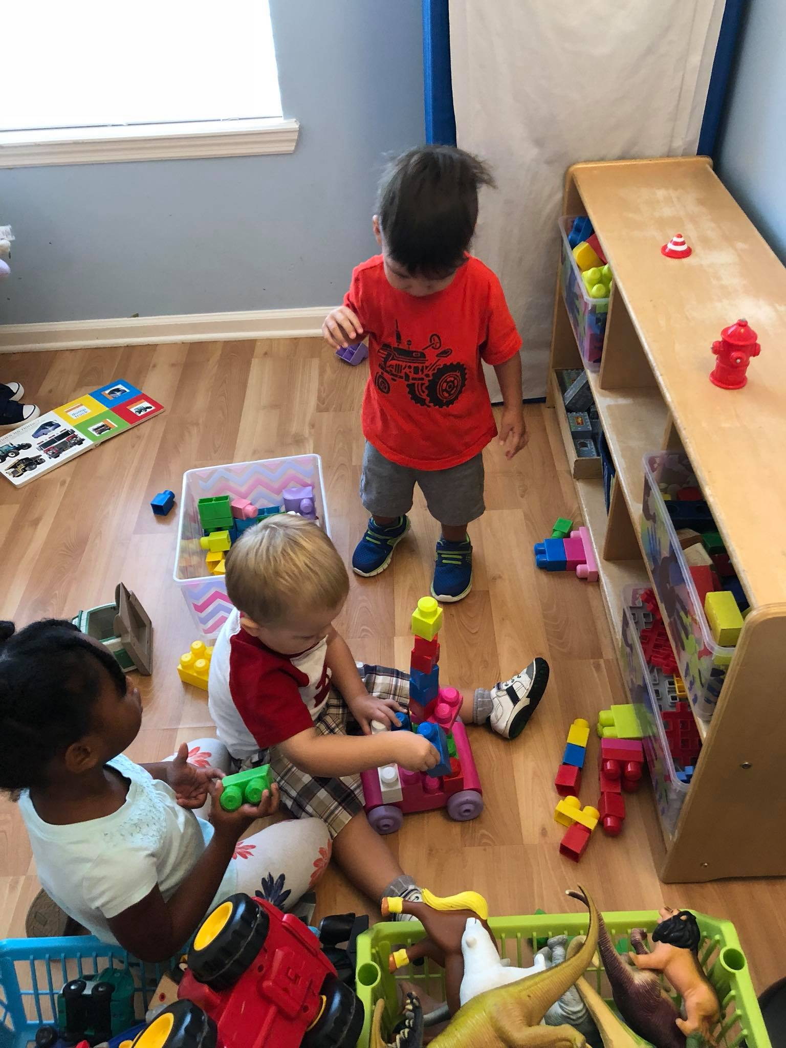 Children building with colorful blocks together